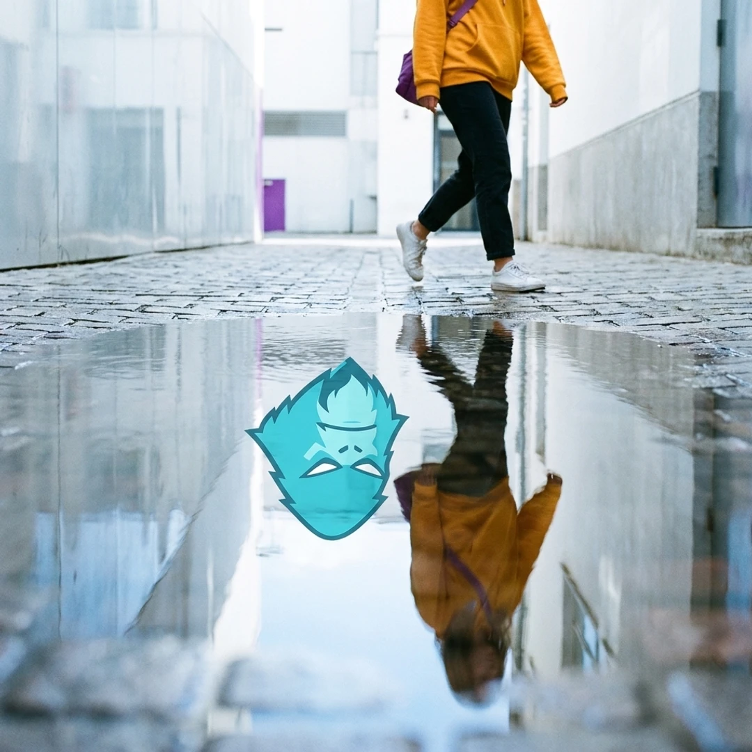 Person in a yellow jacket walking beside a puddle reflecting a cyan VibeSquatch mascot mark.